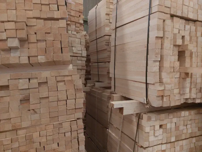 A picture of multiple stacks of sawn tropical timber